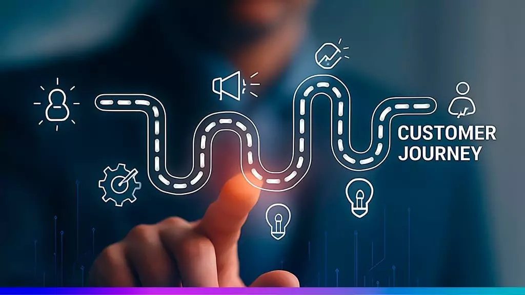Mão tocando interface digital com trilha sinuosa e ícones da jornada do cliente ao lado do texto “Customer Journey”, representando um mapa de influências.