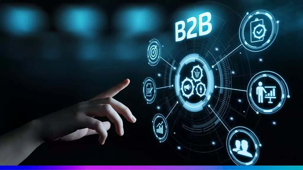 M&atilde;o interagindo com interface digital futurista com o termo B2B e &iacute;cones que representam neg&oacute;cios, marketing e tecnologia empresarial.